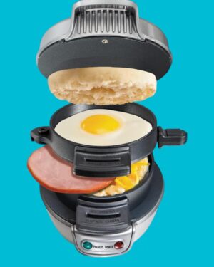 Hamilton Beach Breakfast Sandwich Maker with egg cooker ring preparing a fresh breakfast sandwich