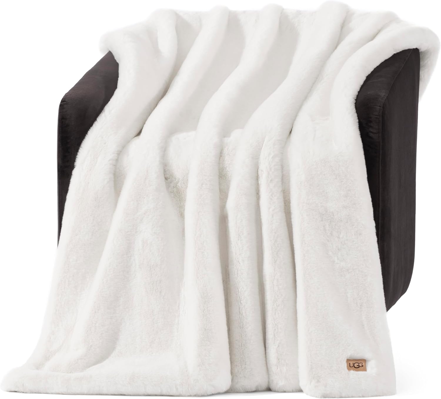 UGG Euphoria faux fur throw blanket in White Snow draped over a bed for cozy luxury home decor