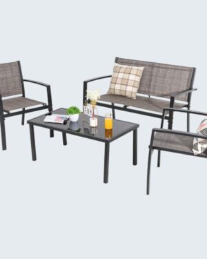 Light brown Shintenchi outdoor patio set with loveseat, two single chairs, and glass coffee table placed on a garden lawn.